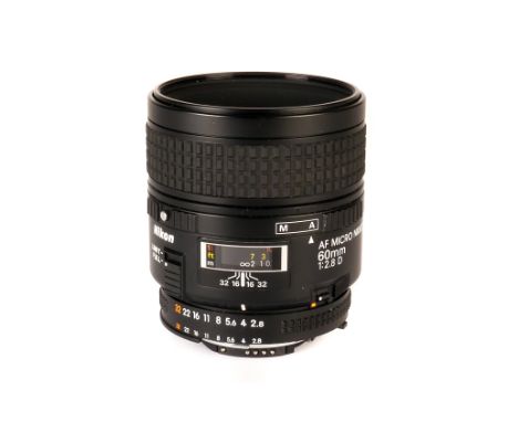 A Nikon Micro-Nikkor AF D f/2.8 60mm Lens, black, serial no. 3092332, body, VG, elements, VG, some light fungus, in maker’s b