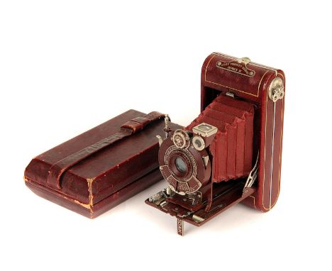 A Kodak Vanity Vest Pocket Series III Camera, red, with Kodak f/6.3 83mm lens, serial no. 33721, body, VG-E, lens, VG, shutte