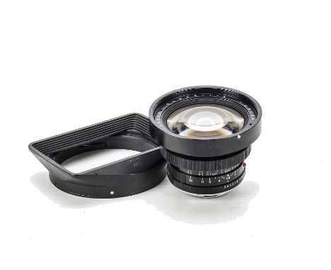 A Leitz Elmarit-R f/2.8 19mm Lens, black, serial no. 2736245, body, VG, elements, VG, hair like debris inside, with maker’s c