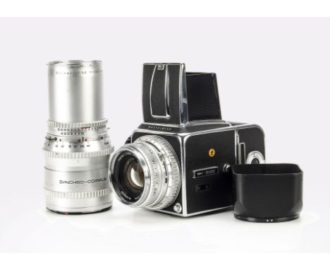 A Hasselblad 500C Camera, chrome, serial no. UH127529, with Carl Zeiss Planar f/2.8 80mm lens, serial no. 4598688, body, G-VG