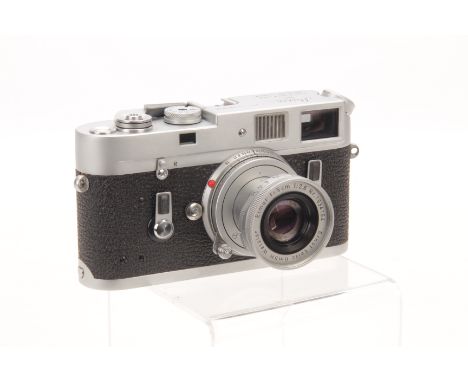 A Leica M4 Rangefinder Camera, chrome, serial no. 1180030, with Leitz Elmar f/2.8 50mm lens, chrome, serial no. 1634154, body