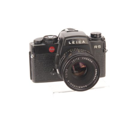 A Leica R5 SLR Camera, black, serial no.1721987, with Leitz Summicron-R f/2 50mm lens, black, serial no. 2864341, body, G, sh