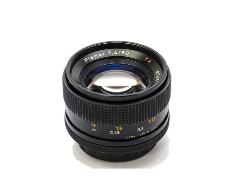 A Carl Zeiss Planar T* f/1.4 50mm Lens, black, serial no. 6745150, body, VG, elements, VG, some light internal haze