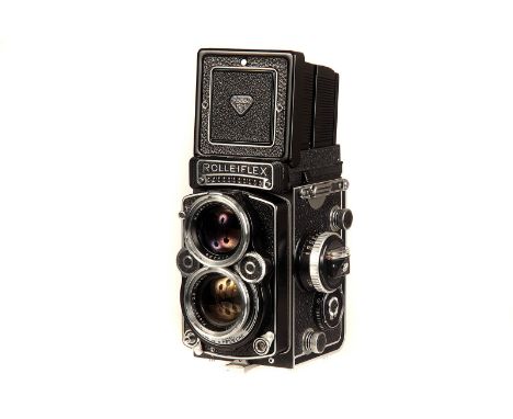 A Rolleiflex 2.8F TLR Camera, black, serial no. 2417296, with Carl Zeiss Planar f/2.8 80mm lens, serial no. 3403241, body, VG