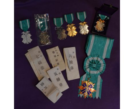 Japan, Order of the Golden Kite, various insignia (5), Sixth Class breast badges (4), in silver-gilt, and Seventh Class badge