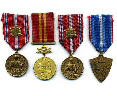 Slovak Republic (1939-45), Bravery Medal, First Class, with Swords, in gilt metal; Loyal Defence Medal (2), both with ribbon 