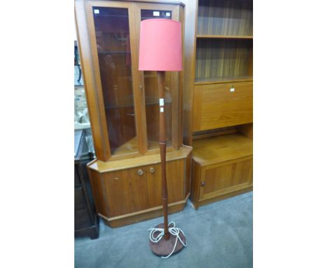 A teak standard lamp 