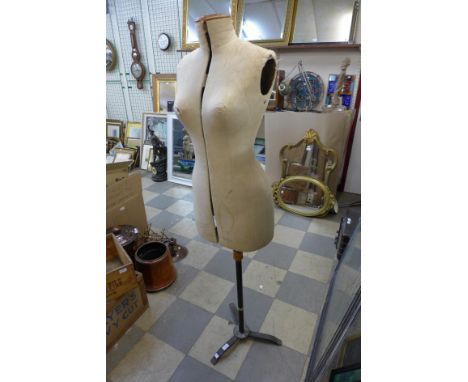 A vintage adjustable mannequin on stand 