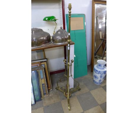 A wrought brass and copper telescopic standard lamp 