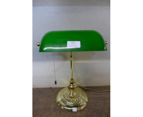 A brass students desk lamp 