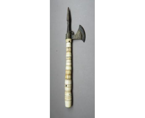 ˜AN INDIAN AXE, 19TH CENTURY with iron head formed with a robust faceted central spike, small crescentic axe-blade decorated 