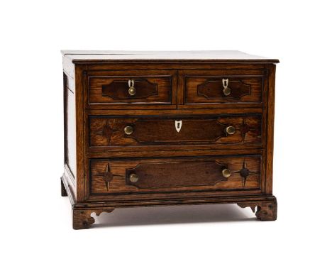 MINIATURE WELSH OAK CHEST OF TWO LONG & TWO SHORT DRAWERS the beaded drawers inlaid with mahogany, holly and bog oak raised o