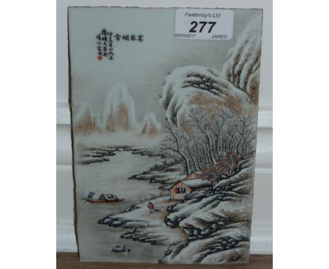 Antique oriental ceramic tile hand painted in enamels depicting a river cottage and boat in winter, with character marks. 19.
