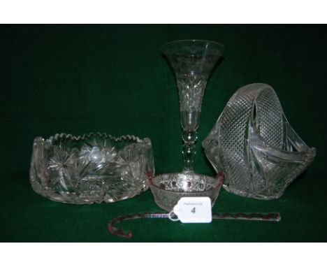 A clear glass miniature walking stick with red twist inclusion, a clear cut glass butter dish with ruby flashing together wit