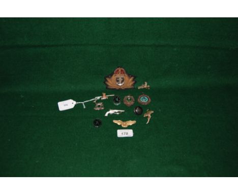 An old Naval cloth badge, an American airforce brass eagle badge together with 6 hunting & shooting medals, a badge and a but