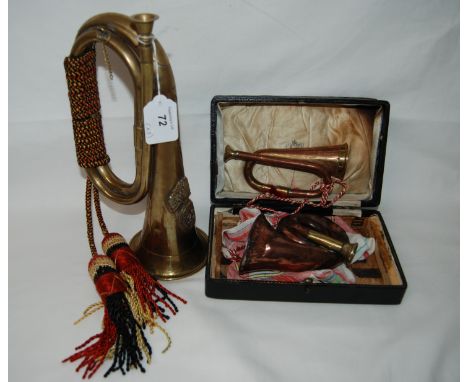 A 23rd Fusiliers brass bugle, 1 small copper bugle and a copper hunting bugle.