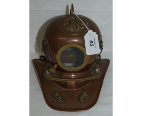 A small copper & brass model of a diving helmet.