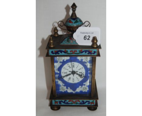 Antique brass clock with Cloisonne enamel decoration.