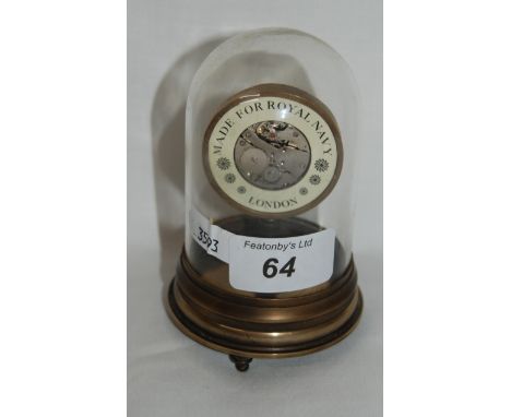 Small brass clock under a glass dome made for Royal Navy London, maker Clement Freres.