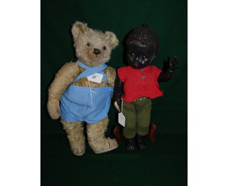 Vintage Steiff teddy bear & 1 black plastic doll by Pedigree toys.