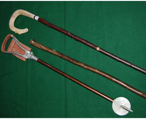 Shepherds crook with carved horn handle depicting scottish thistle together with one other stick and a shooting stick.