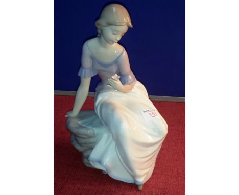 Large Nao figurine of lady sitting gazing at flower, 28cm tall 