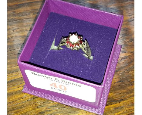 Silver ladies ring with garnet and opal
