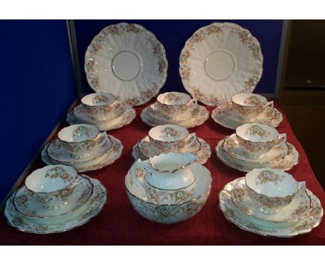 28 piece flower design tea set with crown, T & K stamp to back 