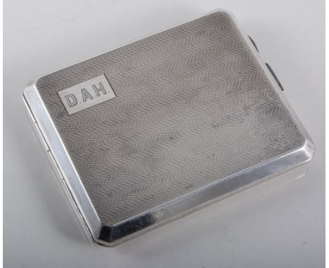 Silver cigarette case with wavy line engine turned decoration, initial plate engraved "DAH", hallmarked Birmingham 1945, 9.5c