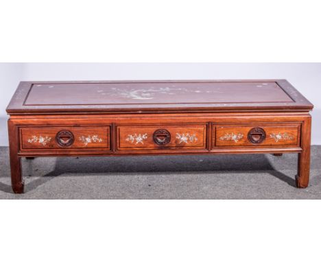 Chinese low table inlaid with mother of pearl birds on a bough, three drawers, 56cm x 137cm.