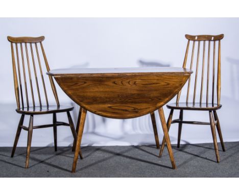 Ercol elm drop-leaf table and four comb-back chairs, 122cm long, 71cm high, (5).