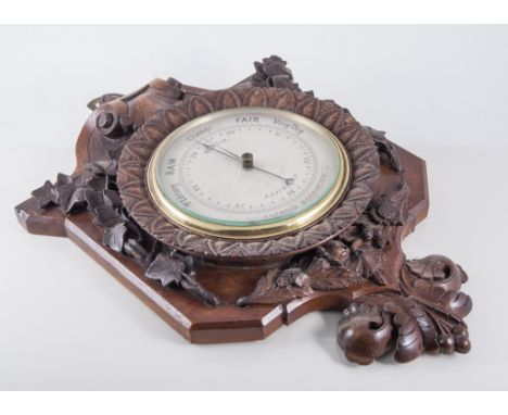 Aneroid barometer, carved oak case, silvered dial, signed Curtis, Leicester, 47cm.