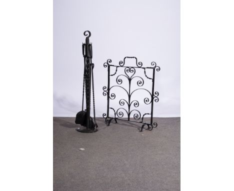 Set of wrought iron fire irons, with a horseshoe base, 92cm, and an associated fire  screen.