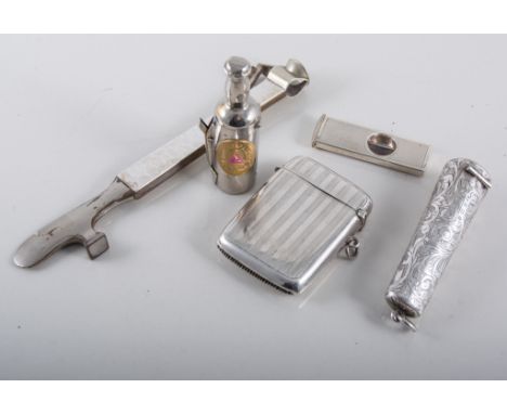 Six silver and other cigar cutters, amber cigar holder with 9 carat yellow gold mount, contained in a silver case scroll engr