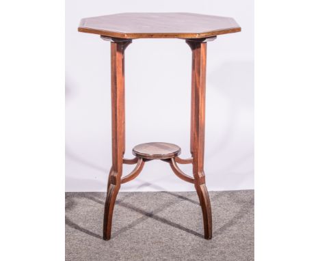 Edwardian mahogany window table, octagonal top, the legs joined by a shelf table, 51cm wide, 68cm high.