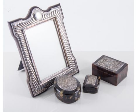 Modern silver-faced photograph frame, easel-back, aperture 12cm x 8cm; a collection of photograph frames; three simulated tor