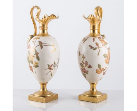 Pair of Royal Worcester ivory ground ewers, painted with spring flowers, gilt highlights, No.1144, circa.1892, height 28cm.