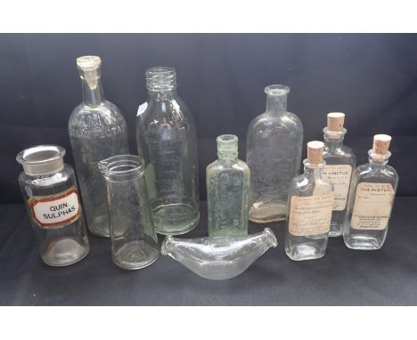 A COLLECTION OF VINTAGE GLASS  MEDICAL BOTTLES including a urine specimen bottle, a baby's feeding bottle and various medicin