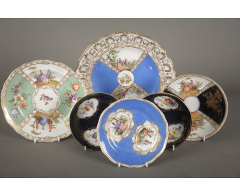 A COLLECTION OF MEISSEN PORCELAIN including two saucers with dark blue ground with three reserves of painted flowers, a mid-b