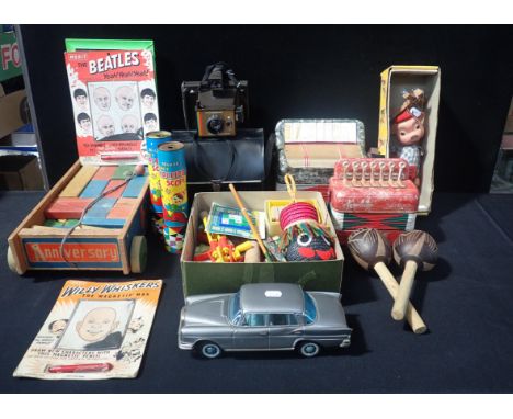 A 'PINKY' PELHAM PUPPET, A MERIT 'BEATLES' MAGNETIC TOY two children's accordians, and other toys