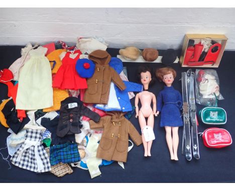 TWO  PEDIGREE VINTAGE SINDY DOLLS (one head detached) and an assortment of outfits, skie, riding, day dresses, wigs, etc