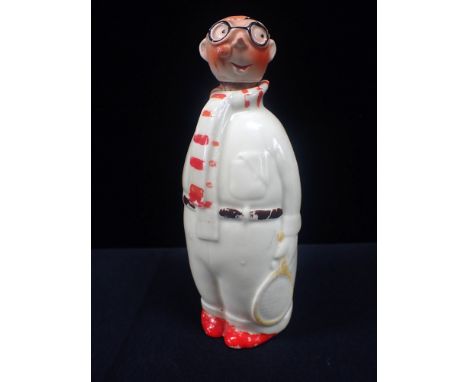 AN UNUSUAL 1930s CERAMIC TENNIS PLAYER DECANTER 19cm high
