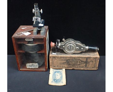 A CALMIC MANUAL RESPIRATOR in wooden box, a small  Tacon school microscope and a Macaura's Patent Blood Circulator in origina