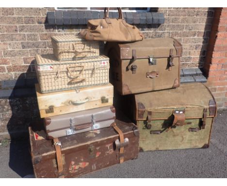 TWO VICTORIAN CANVAS COVERED WICKER TRUNKS the smallest by H. Pook and Son, Bristol  65cm wide (woodworm),another old trunk, 