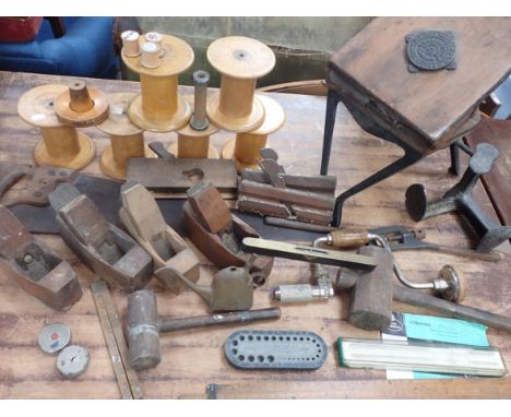 A COLLECTION OF ANTIQUE TOOLS including planes, level, rules, a vintage Faber-Castell slide rule with instructions, a forge b