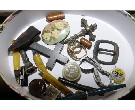 Champagne cork, amber pipe stems, crucifix, carved wooden button, Bond Bread pin badge etc.