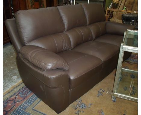 As new brown leather three seat sofa (less that 6 months old) 