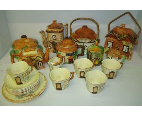 Large selection of Cottage Ware including tea pot, coffee pot, biscuit barrels, cups and saucers, butter dish etc.