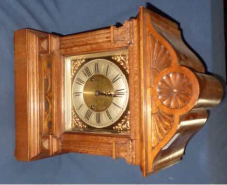 Walnut case mantel clock with brass dial and striking movement