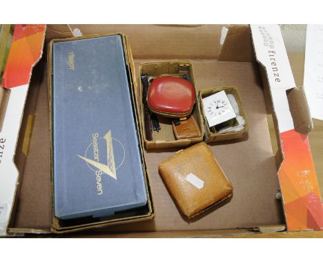 Selection of various watch parts including Tisso 7 Star set, travelling clocks, collection of watch straps and a brass and wh